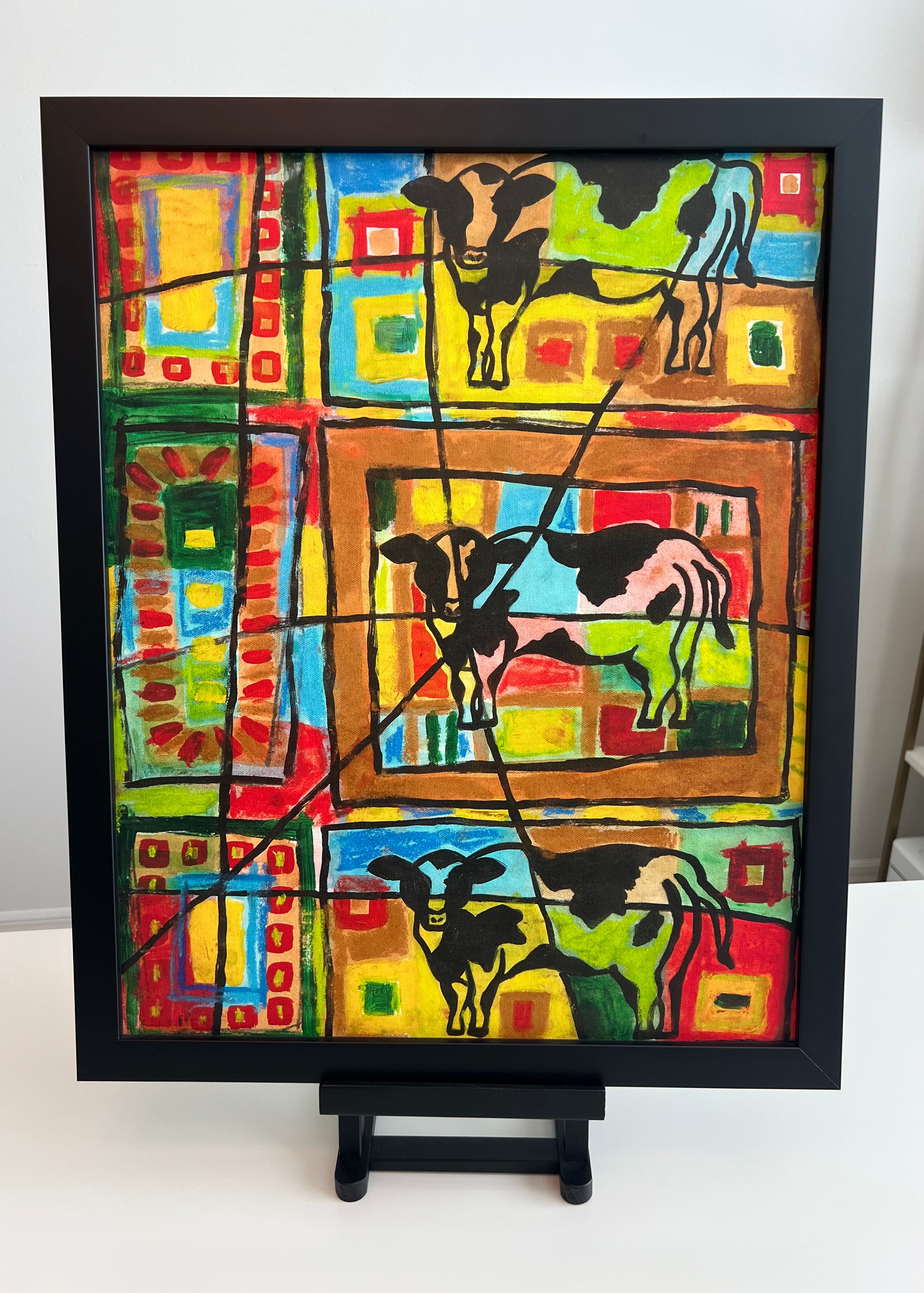 Cow print in black frame