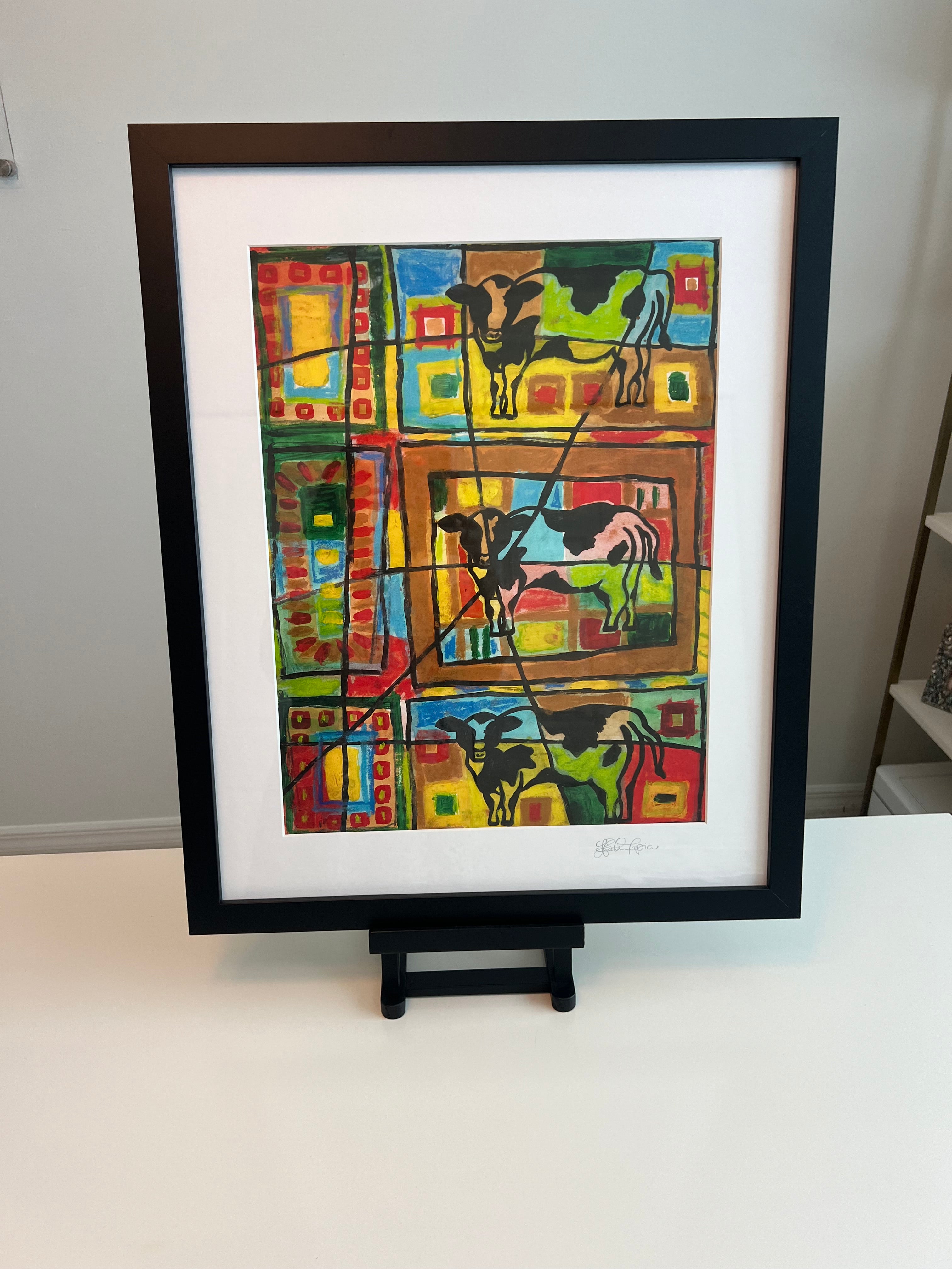 Cow painting with white matting and black frame