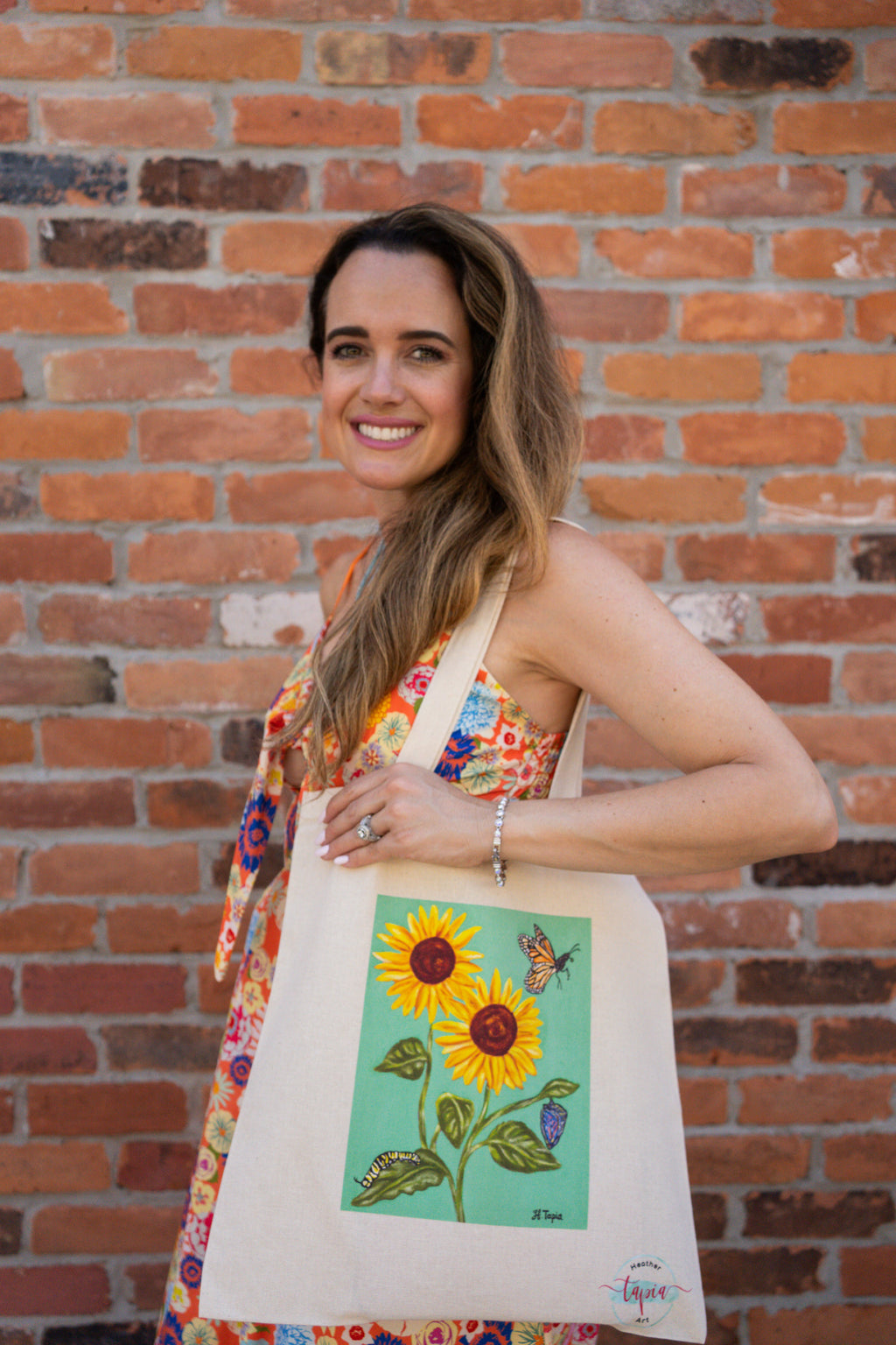 Sunflower tote bag with light green background.