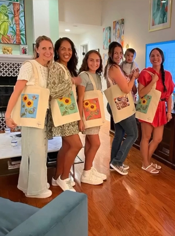 Sunflower tote bag with coral background.